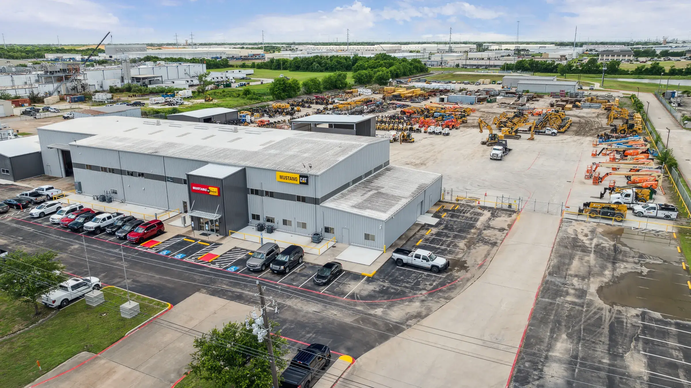 Aerial of the building with the customer lot on one side and the equipment yard on the other