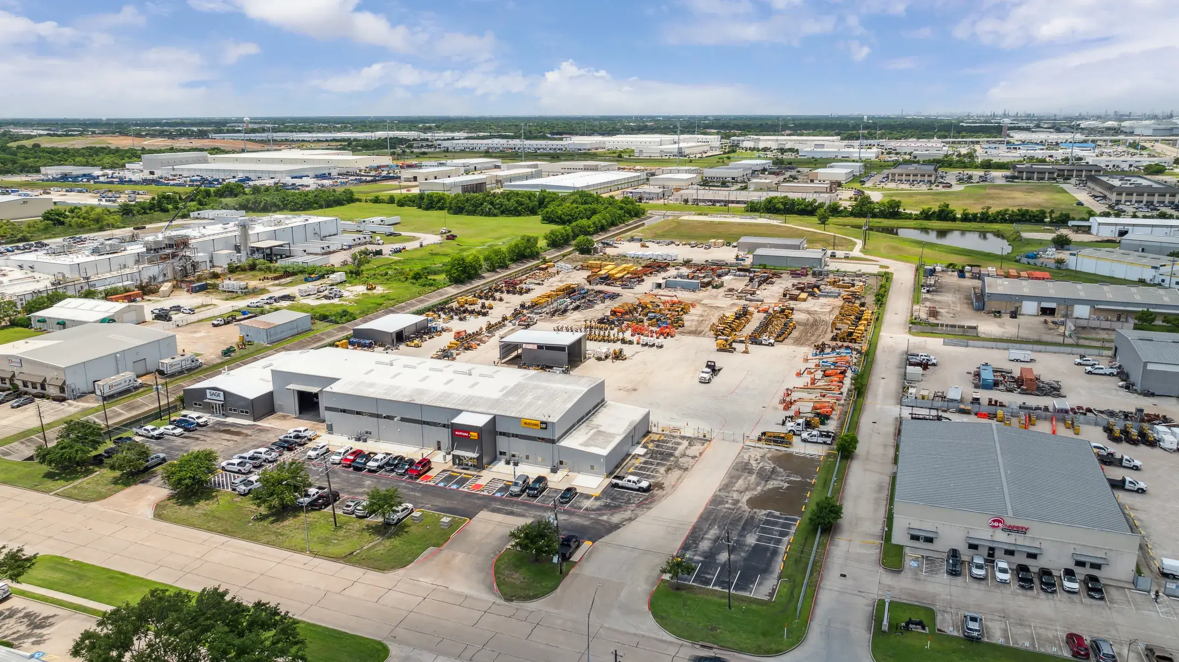 Aerial looking down the row of open service bays with machines pulled up outside