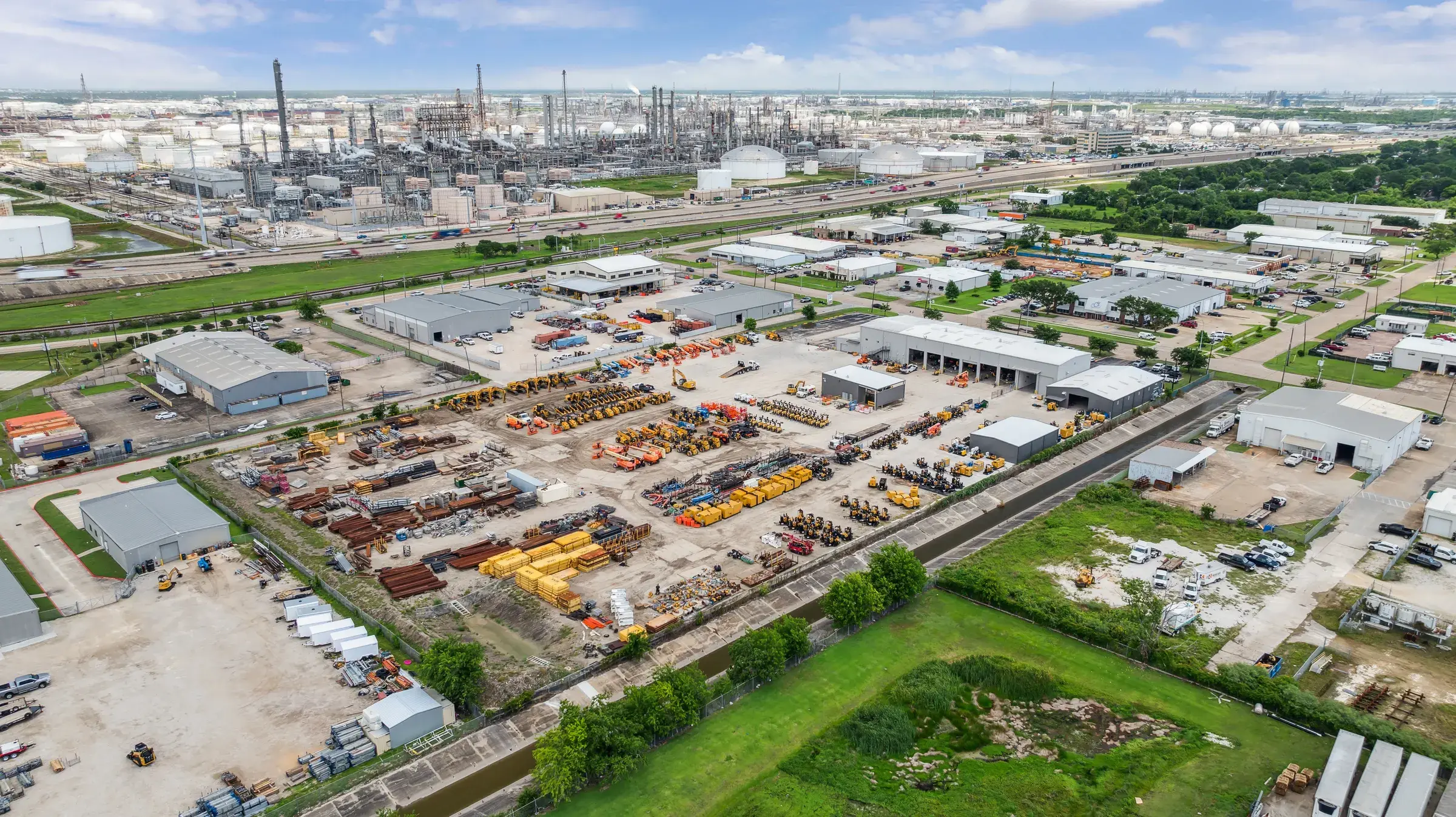 The facility in its Deer Park setting, refinery stacks along the horizon
