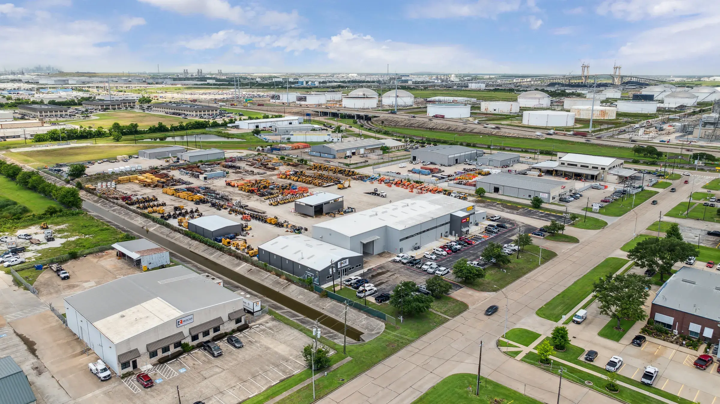 Wide aerial of the surrounding industrial district with the site at its center