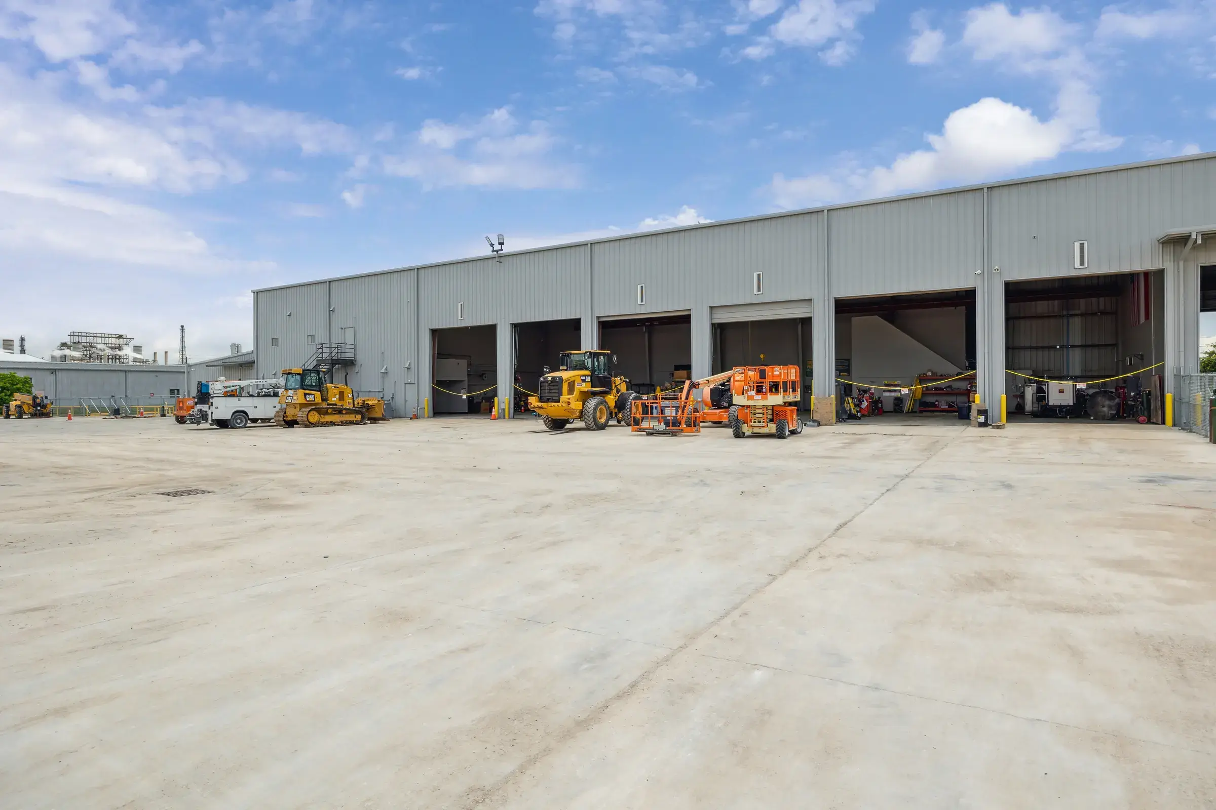 Machines staged outside the open bays, waiting to go in for service