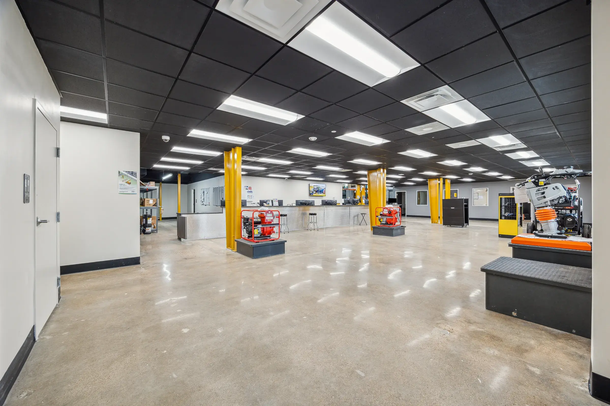 The parts and service floor inside, yellow-guarded columns running its length