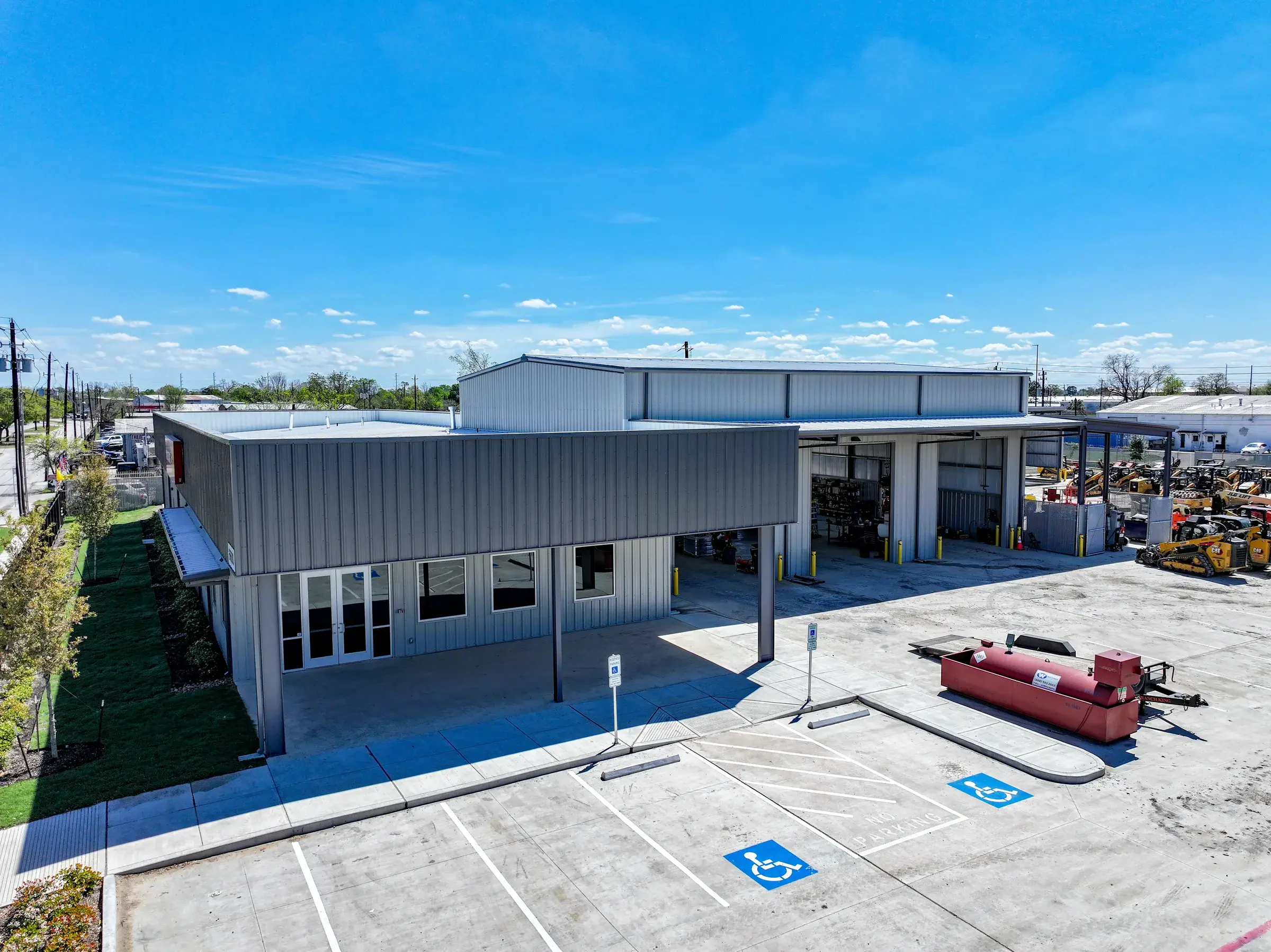 The finished storefront and covered entry, seen across the new parking area
