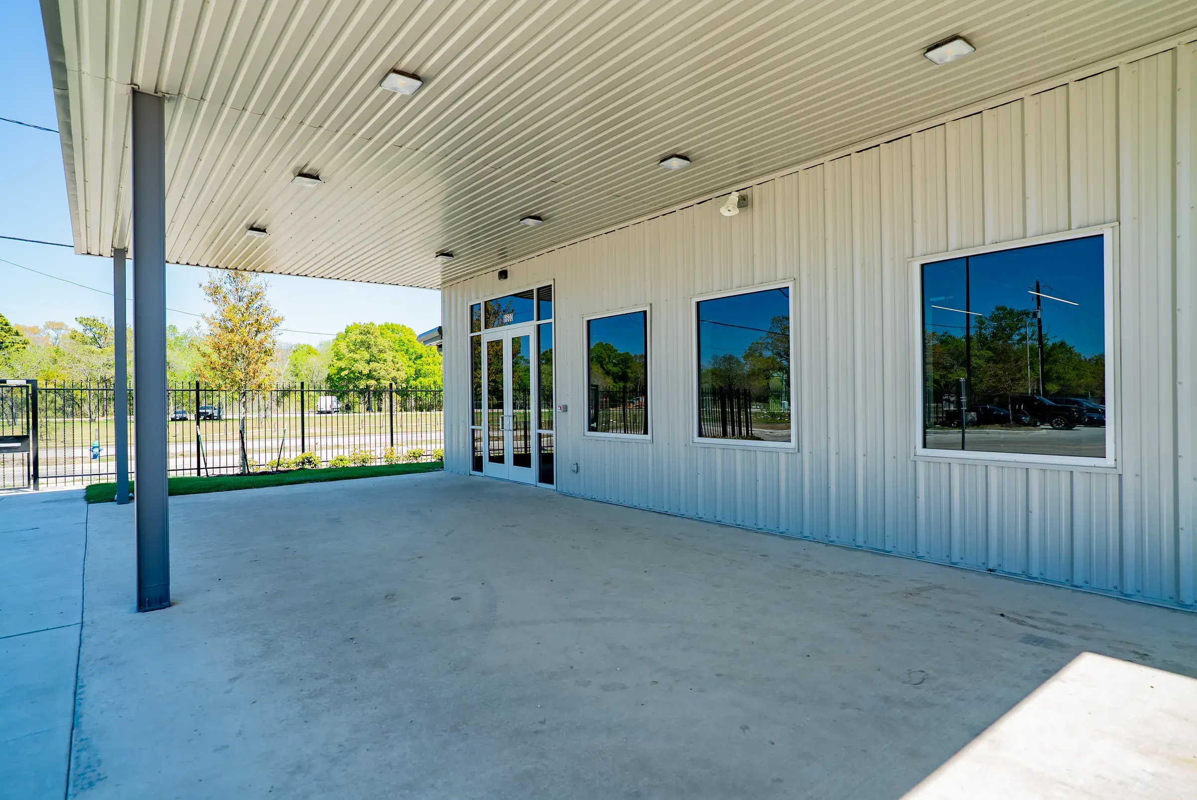 The covered walkway running along the front of the building
