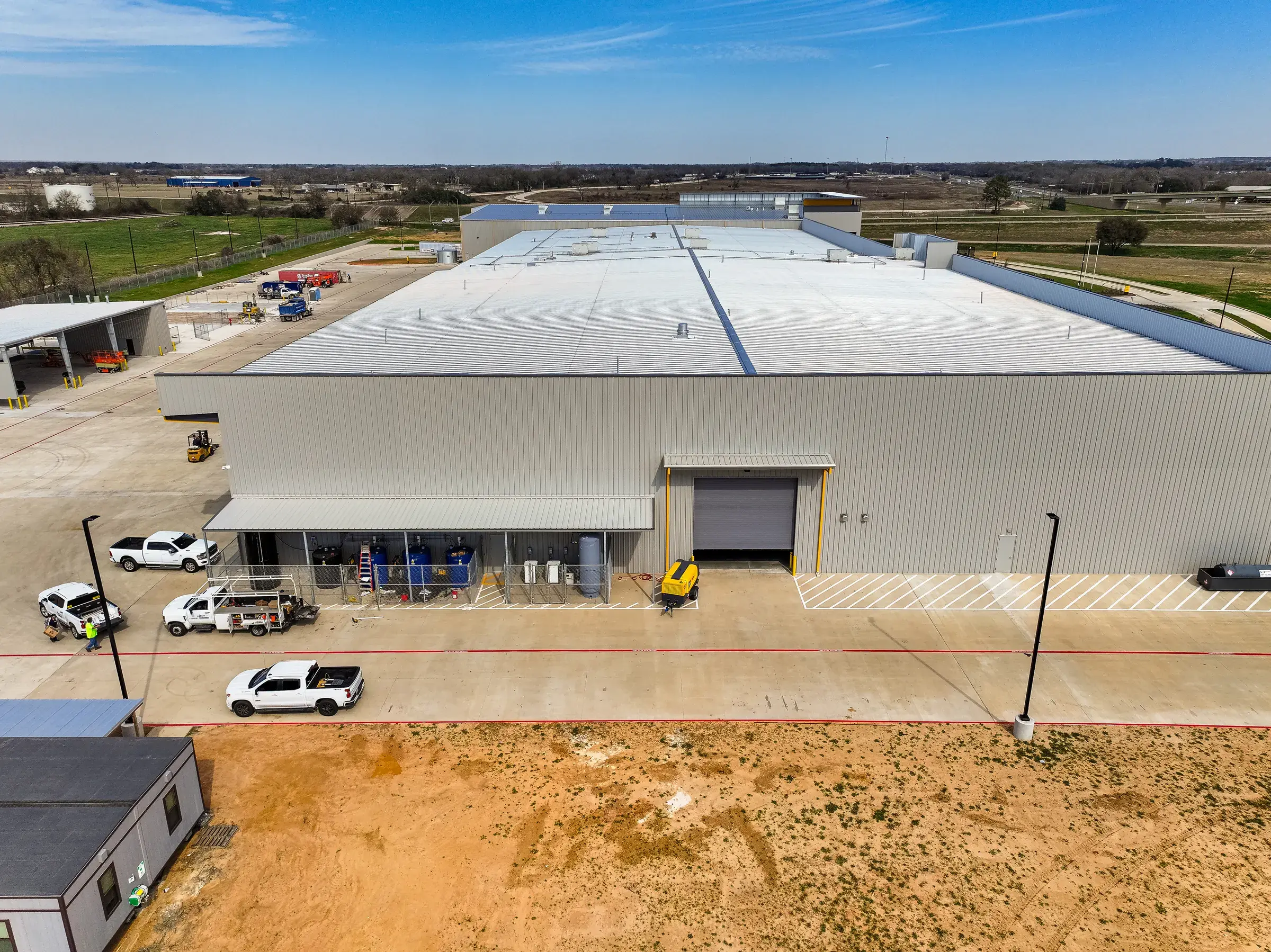Aerial of the shop from the yard side, the full roof and apron in frame
