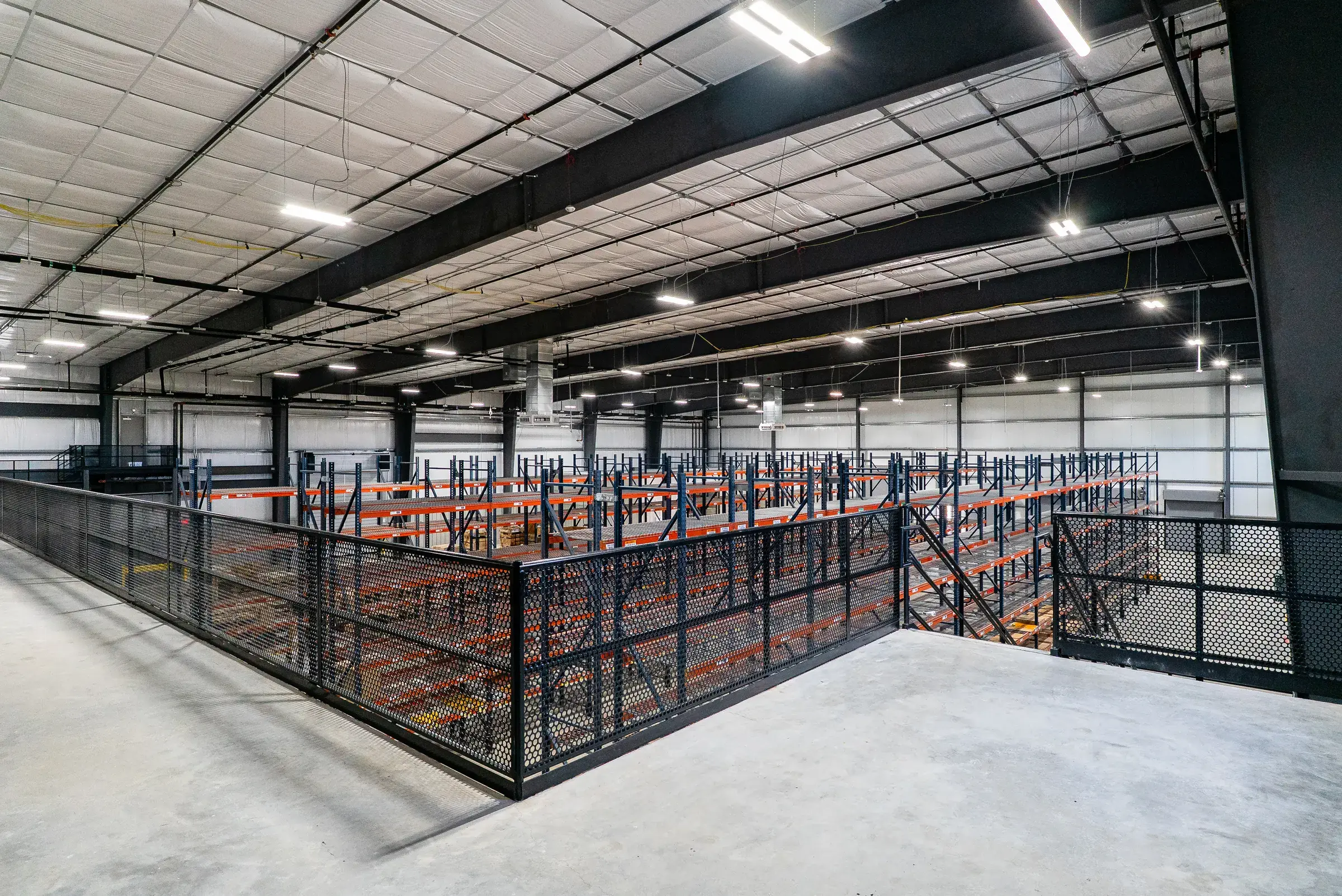 The mezzanine level looking out over the pallet racking below