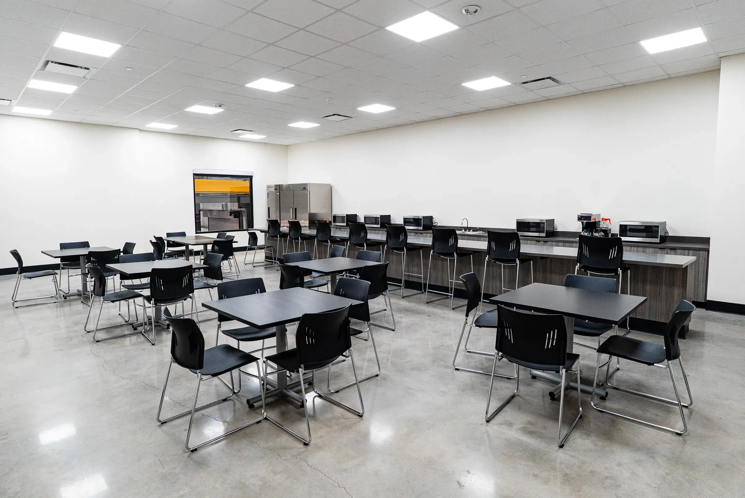 The training room laid out with tables and seating for the crews
