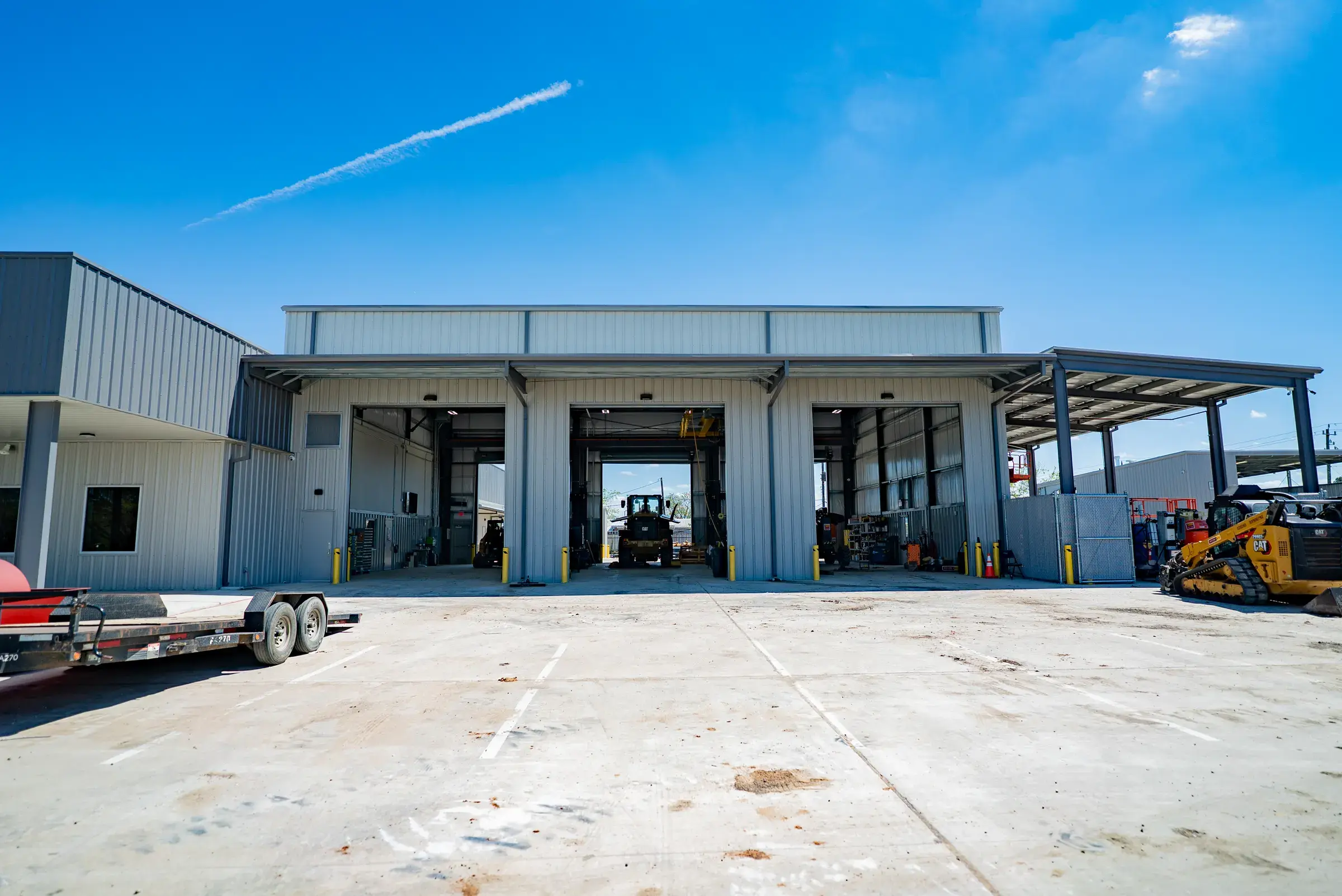 The drive-through service bays under their steel canopy